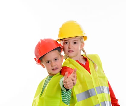 boy and girl with reflective vest and helmet in front of white background