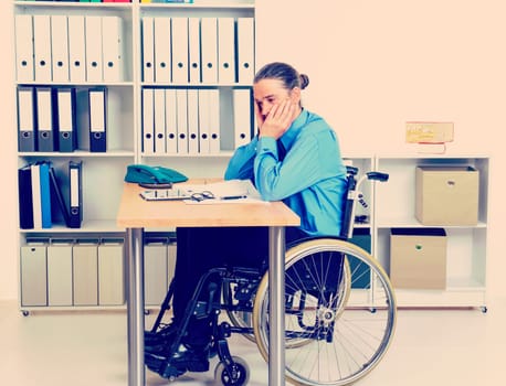 disabled business man in wheelchair is depressed