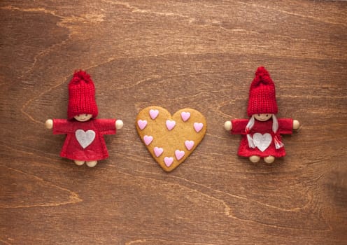 love couple toys hold hands and heart made of cookie
