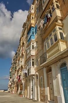 VALLETTA, MALTA - OCTOBER 30, 2017: Traditional colorful architecture and houses with balconies in Valletta in Malta.