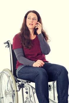 young woman in wheelchair calling with cellphone