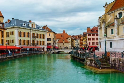 Annecy, France - May 01, 2018: Medieval old town and the tower of Palais de l'Isle castle on Thiou river in Annecy, Savoy, France