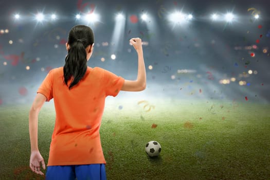 Happy asian soccer player woman celebrate the match win on the field