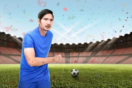 Young asian football player man playing the ball on the field
