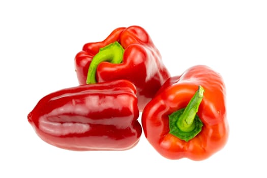 Three Red pepper. Closeup. Isolated on white background.Concept Health.