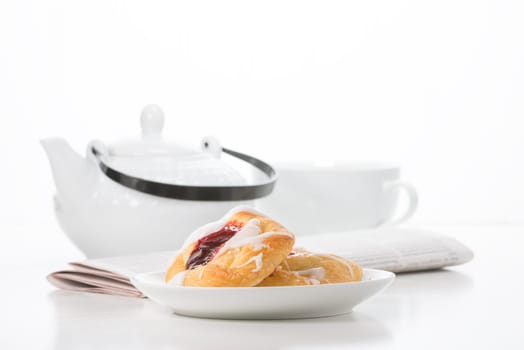 Morning breakfast of raspberry danish and coffee.
