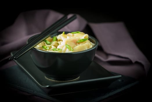 Bowl of chinese shrimp wontons and noodles.