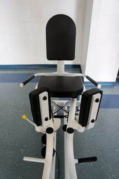 abduction aduction machine indoors gym equipment