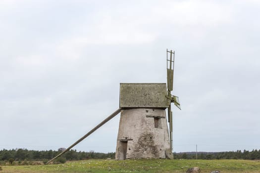 Windmill on Gotland, Sweden with a cloudy sky.