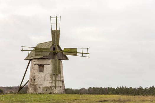 Windmill on Gotland, Sweden with a cloudy sky.