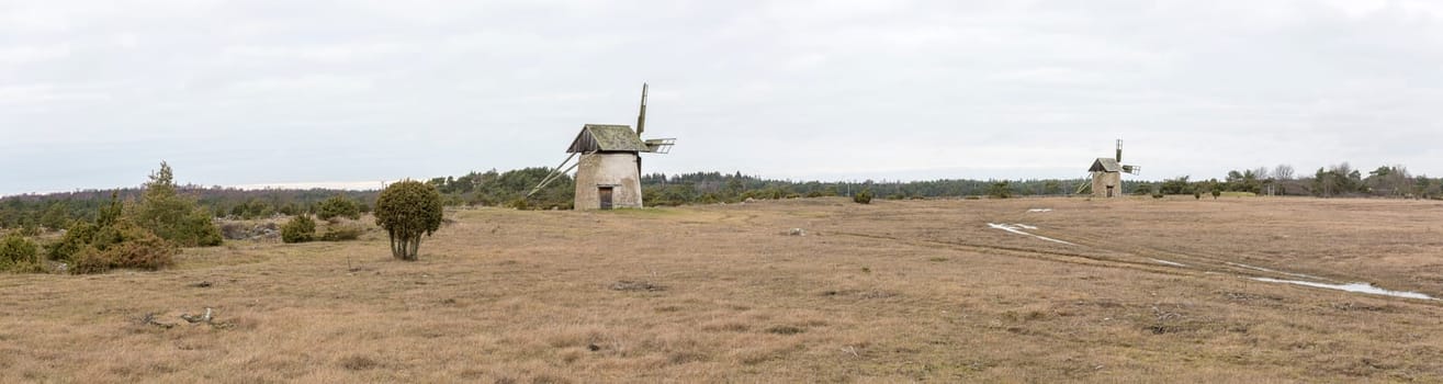Windmills on Gotland, Sweden with a cloudy sky.
