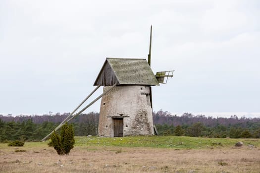 Windmill on Gotland, Sweden with a cloudy sky.