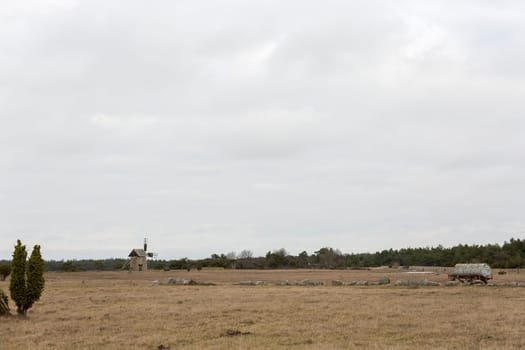 Windmill on Gotland, Sweden with a cloudy sky.