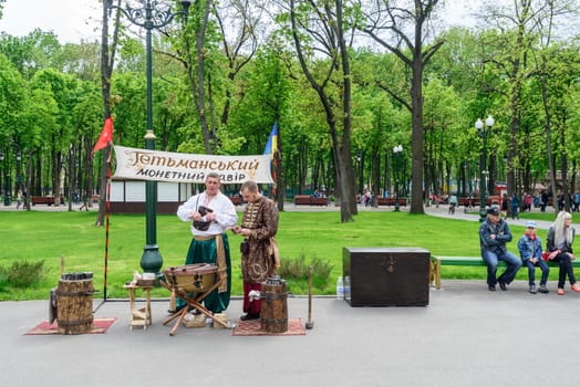 Kharkiv, Ukraine - May 01, 2014: traditional ukrainian musician couple playing in a public park in kharkiv