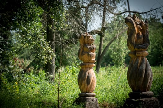 Nice wodden sculpture representing squirrels, in an ukrainian forest