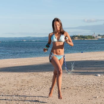 Beautiful and sexy girl running at the beach in dominican republic