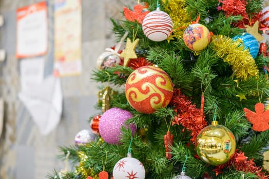 portion of a Christmas tree with colorful decorations