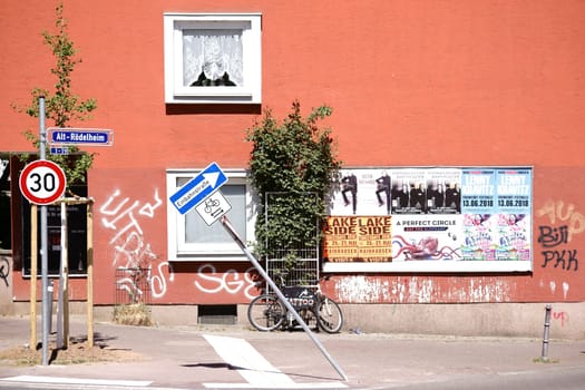 Frankfurt,Germany – May 06,2018: Advertising posters,graffiti and graffiti Tags on a house wall in the trendy Rödelheim district on May 6,2018 in Frankfurt.