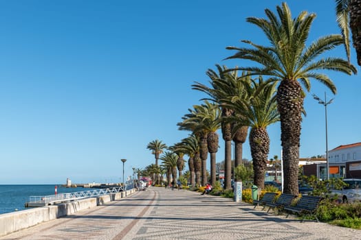 LAGOS, PORTUGAL - CIRCA MAY 2018: Avenida dos Descobrimentos with tourists walking, Lagos, Algarve, Portugal
