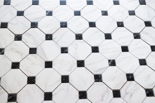 Black and white checkered marble floor, stock photo