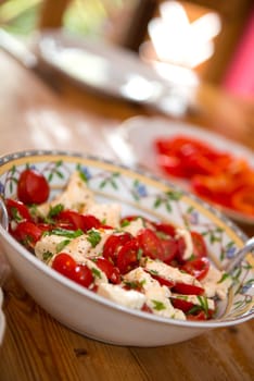 tomato and Mozarella- salad on wooden table