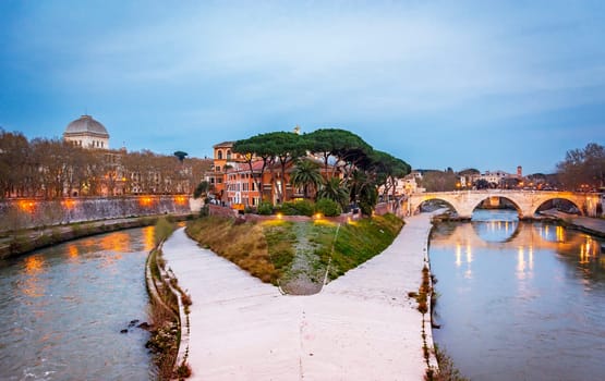 The historical Tiber island from the Garibaldi Bridge in Rome.