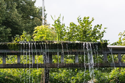 Small weir waterfall in a public park