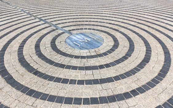 Close-up of pavement with concentric pattern. Patterned floor walkway of the large square of a church.