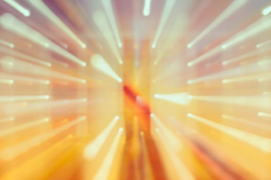 Aabstract yellow blurred lights trail background using motion zoom burst technique