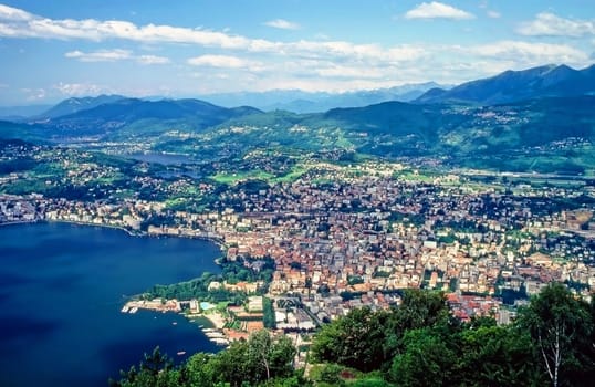 Lugano with lake and harbor in Switzerland
