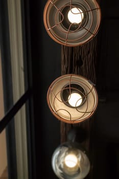 Light bulbs hanging from ceiling, stock photo