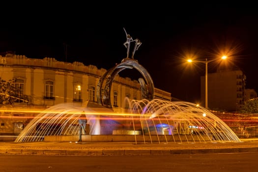 LOULE, PORTUGAL - CIRCA MAY 2018: Water fountain at night in the old town of Loule at the Algarve of Portugal in Europe.