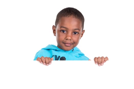 Young boy posing with a white board