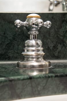 Close Up of water crane in bathroom