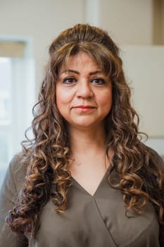 Portrait of a mature woman indoors.