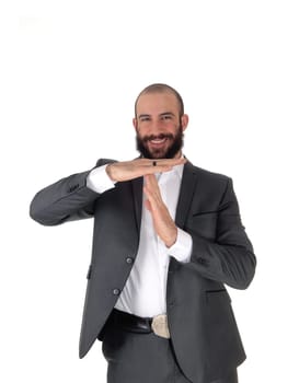 A young handsome businessman standing in a suit with a beard .signing he wants to talk, isolated for white background.