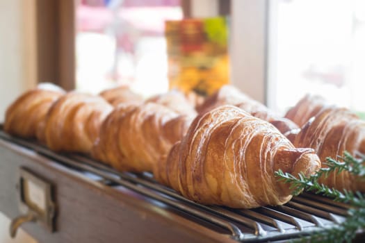 Fresh baked croissant for sale, stock photo