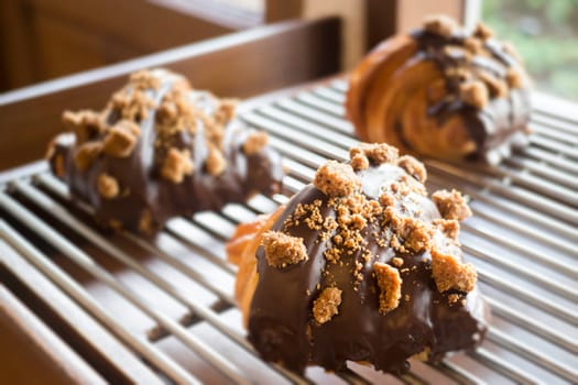 Fresh baked chocolate croissant for sale, stock photo