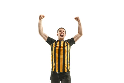 The young Belgian fan celebrating on white background. The young man in soccer football uniform as winner isolated at white studio. Fan, support concept. Human emotions concept.