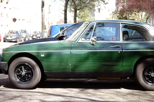Mainz,Germany - April 19,2017: The side profile of a dark green MG Roadster sports car and classic car on April 19,2018 in Mainz.