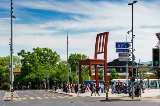 Geneva, Switzerland - April 04,2018: The Place of Nations,  gigantic 'Broken Chair', symbol of the fight against landmines at May 10, 2013 in Geneva, Switzerland. Around are the headquarters of about 250 international organizations. Artist Daniel Berset.