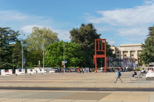 Geneva, Switzerland - April 04,2018: The Place of Nations,  gigantic 'Broken Chair', symbol of the fight against landmines at May 10, 2013 in Geneva, Switzerland. Around are the headquarters of about 250 international organizations. Artist Daniel Berset.