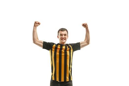 The young Belgian fan celebrating on white background. The young man in soccer football uniform as winner isolated at white studio. Fan, support concept. Human emotions concept.