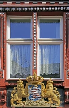 Detailed view of half-timbered house in Marburg with Hessian coat of arms