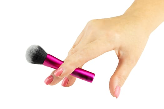 Closeup of female hand is holding professional makeup brush. Concept beauty...