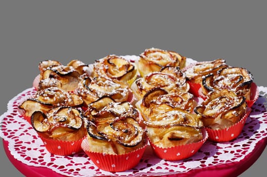 Apple rose muffins on a red cake platter