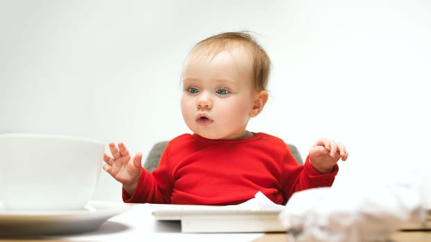 How many documents can I sign child baby girl sitting with keyboard of modern computer or laptop in white studio background. Businesswoman, lady boss and girl-boss concepts