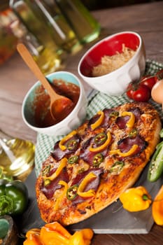 Delicious pizza served on wooden table