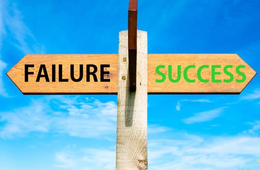 Blank wooden signpost with two arrows over clear blue sky with copy space, just add your text here