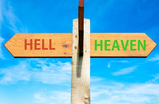 Blank wooden signpost with two arrows over clear blue sky with copy space, just add your text here